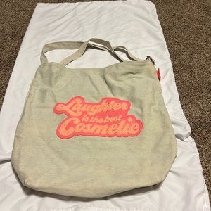 Benefit laughter is the best cosmetic tote bag